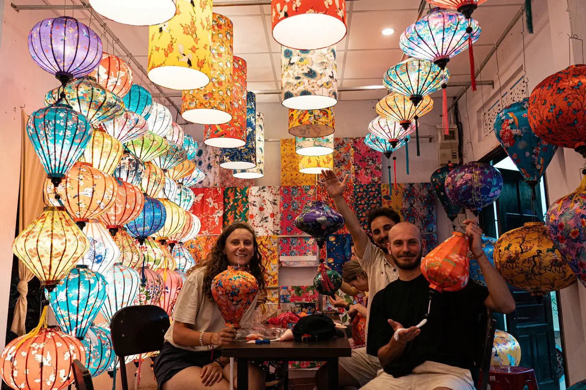 Guests showing the lanterns they made in class