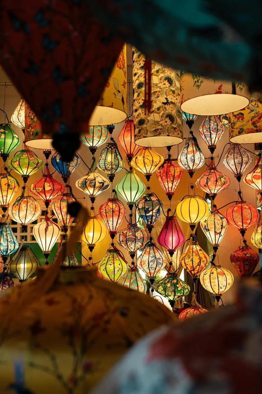 Colorful silk lanterns displayed inside the workshop
